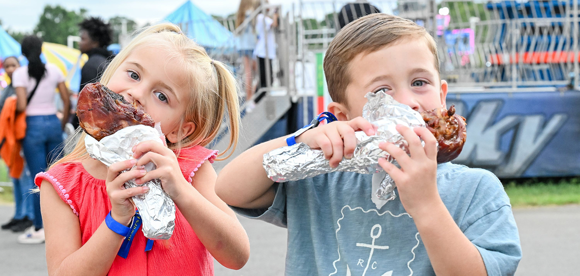 Rotating banner image 1, children eating food.